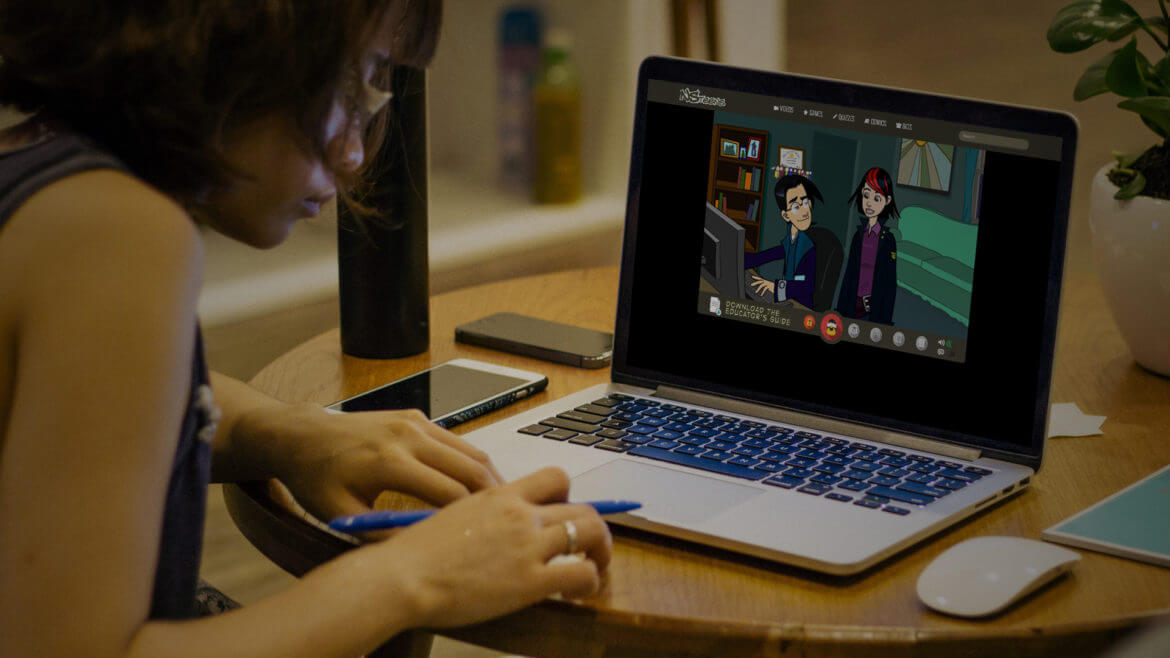 Woman navigating NCMEC eLearning game on laptop