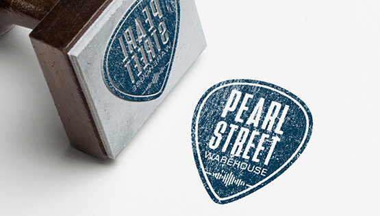 Logo design for Pearl Street Warehouse, a music club in Washington, DC. as it appears on a rubber stamp