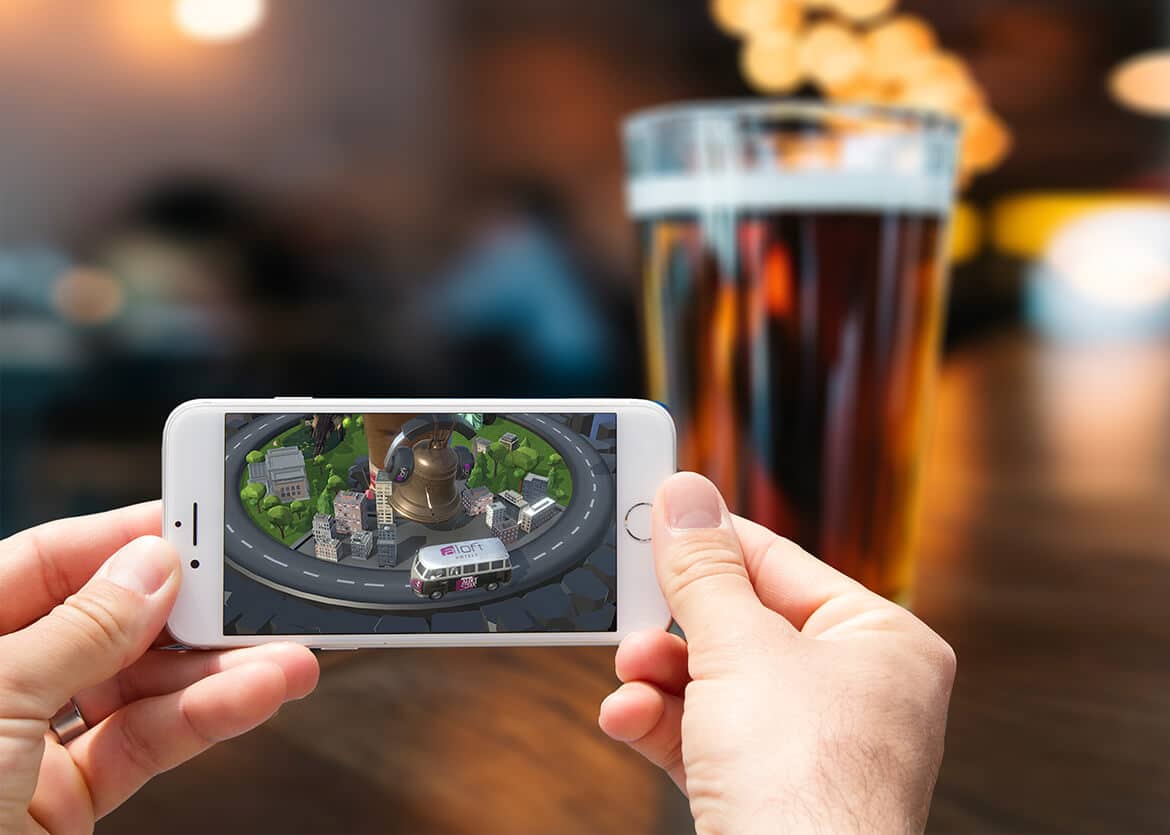 Hotel guest using the Aloft Hotels AR app at a hotel bar