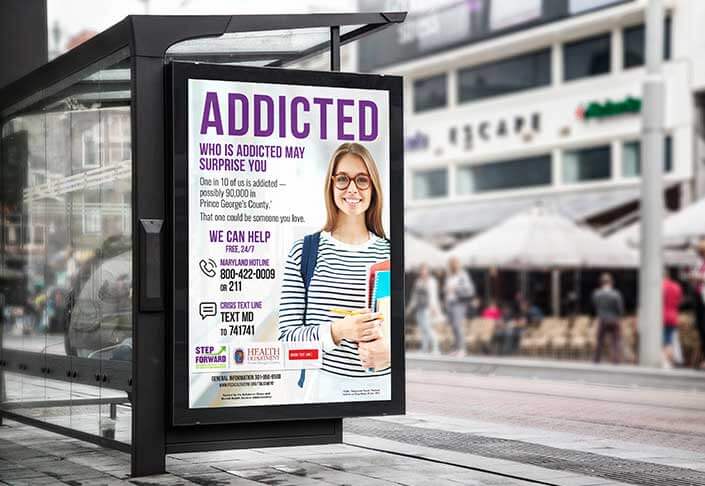 Step Forward program "Addicted" poster in place on bus stop window