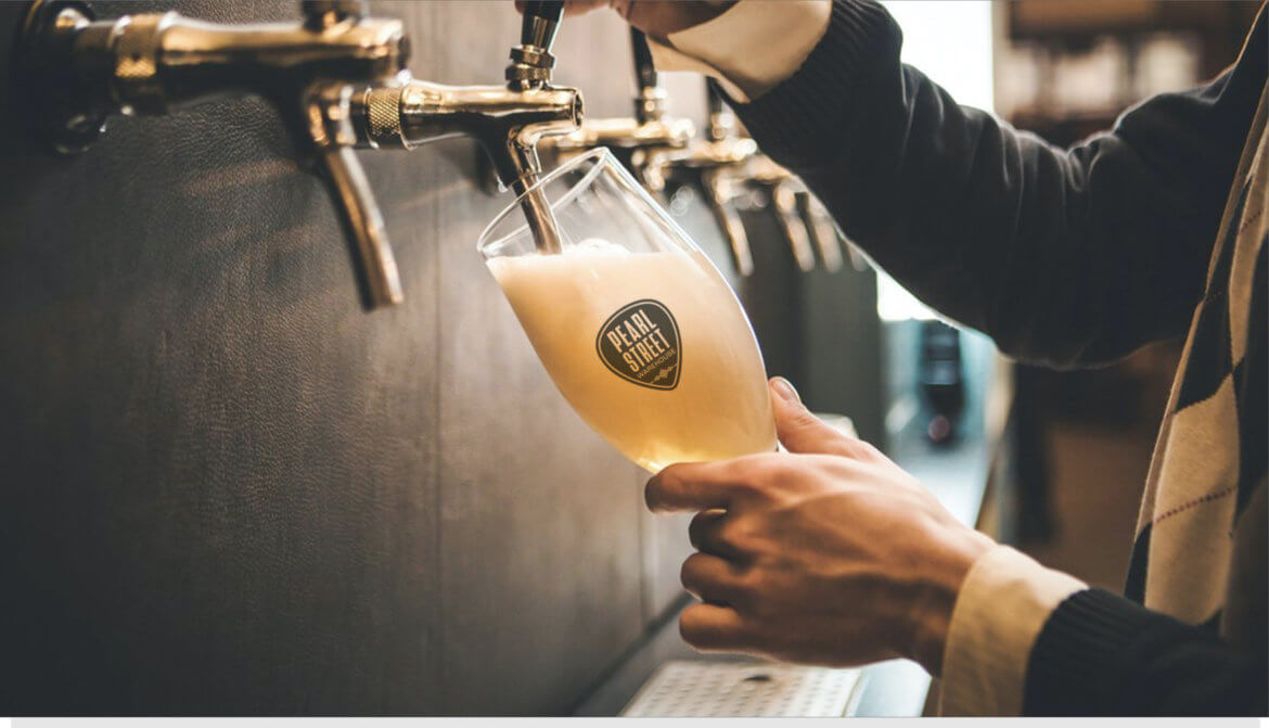 Pearl Street Warehouse brand identity — guitar pick logo mark