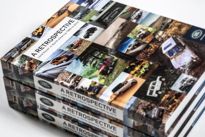 Land Rover reference guide interior spread: model chapter with year-by-year history layout
